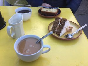 Coffee with walnut cream cake and jam n coconut sponge 😍 at Karmic Cakery in Berwick-upon-tweed