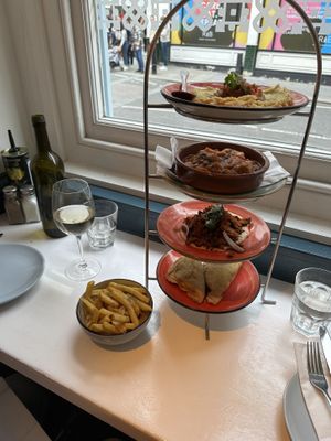 Chips, fava dip, planted meat, gigandes, filo triangles  at The Real Greek - Covent Garden in London