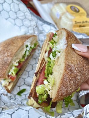 Vegan Turkey Bea-con Club! (vegan: turkey, bae-con, provolone, lettuce, tomato, mayo)   at Harmony Plant Fare in Cincinnati