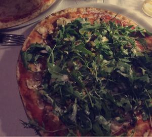 Pizza with mushrooms, rocket, tahini, falafel and vegan mozzarella cheese  at Be Bop in Milan