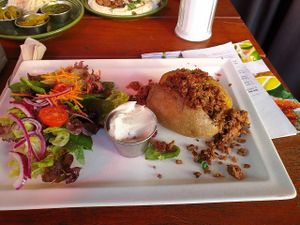 Baked potato with Beyond meat, salad and sour cream at Zeil Kitchen in Frankfurt