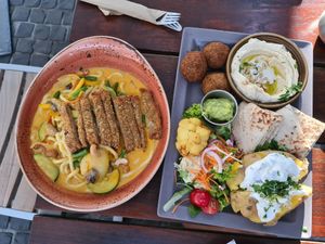 Udon noodles with schnitzel, Zeit plate with baked potato at Zeil Kitchen in Frankfurt