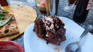 warm gluten free chocolate cake with coconut ice cream and chocolate sauce mashup so yum. at Salgados Veganos Manaus in Manaus