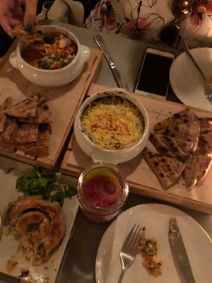 (Top to bottom) baked herbed feta, spinach artichoke dip, phyllo roll  at Katharos Lounge in Santorini