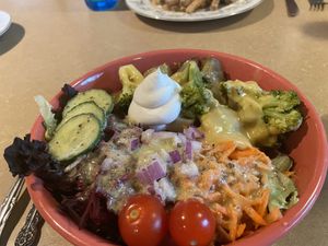 Loaded potato with side salad  at Thrive Diner in Pittsfield