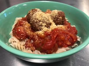 Marinara with mockballs over gluten free brown rice pasta, topped with almond parm at Thrive Diner in Pittsfield