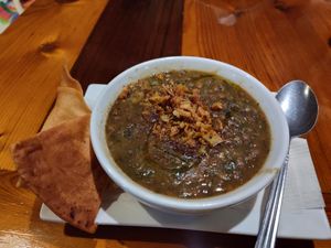 Lemon lentil soup: spinach, potato, lemon, cilantro and pita chips fresh ingredients so tasty! at Kareem's in Naples
