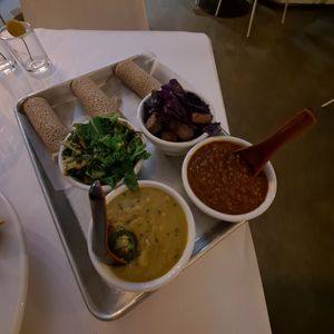Eat the Rainbow: red lentils, turmeric garbanzo, purple cabbage with potato, mixed greens sauteed with onion and cardamom, with Teff injera (gf) at Berbere by T&T in Santa Monica