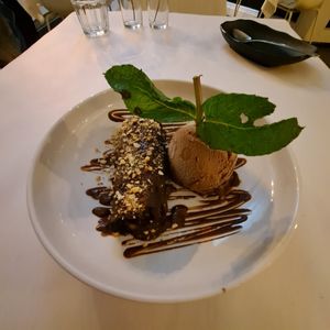 Sublime Confection: crisp rolled banana spread with Almond Butter, and housemate hazelnut Nutella, drizzled chocolate sauce, and ice cream.😋 at Berbere by T&T in Santa Monica