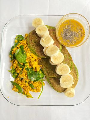 Green power pancakes topped with house made sauce, and side of tofu scramble (GF) at Berbere by T&T in Santa Monica