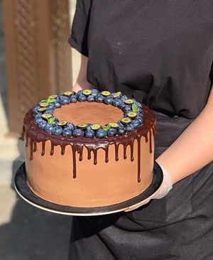 Vegan chocolate cake with cherry filling and coconut cream. Photo by Seldereybar at Selderei in Krasnodar