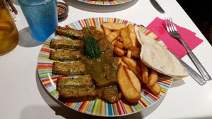 Tofu with carrot sauce and french fries  at Tropic Addict in Montpellier