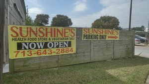 Signs outside at Sunshine's Health Food Store and Vegetarian Deli in Houston