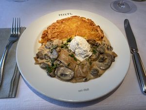 Züri Geschnetzeltes:
Champignon, Bio-Seitan, Weisswein, Rösti, vegane Schlagcrème  at HILTL - Sihlstrasse in Zurich
