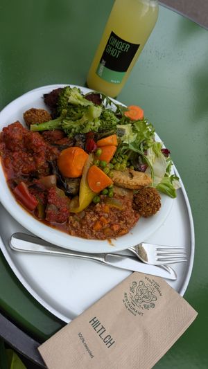 Full buffet plate with ginger shot lemonade to drink at HILTL - Sihlstrasse in Zurich
