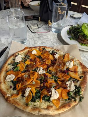 Squash, kale and homemade vegan cheese pizza! at True Food Kitchen in The Woodlands