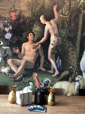 Great mural of Adam and Eve I’m Eden eating fruit and surrounded by animals!  at Sasu Juice Bar in Zurich