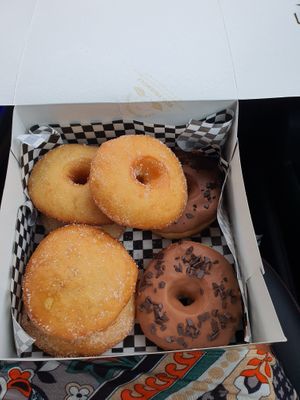 Donut nature, chocolate donuts and filled donut with cream at Radagast Vegan Bakery in Rome