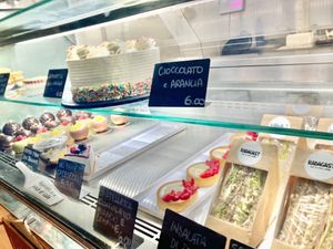 Display of the food. You can also notice some savoury choices: sandwich with vegan chicken salad, vegan cooked ham and mozzarella, vegan tuna and tomato  at Radagast Vegan Bakery in Rome