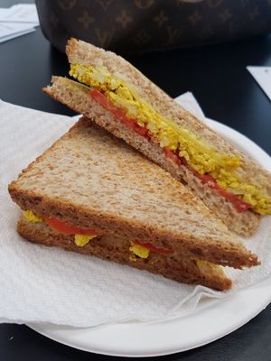 Sandwiche with scrambled tofu curcuma tomato and vegan cheese at Radagast Vegan Bakery in Rome