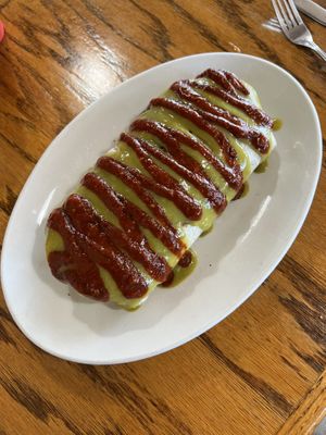 guisado burrito with soy chorizo smothered in their red and green sauce  at La Cabana de Raya in Astoria