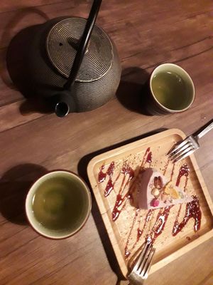 Cheesecake and pot of green tea at Manipura Ethic Cafe & Bar in Baku