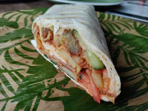 Wrap full of vegetables and fried potato at Manipura Ethic Cafe & Bar in Baku