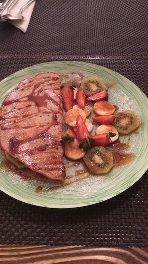 Pancakes with dates syrup  at Manipura Ethic Cafe & Bar in Baku