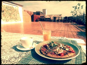 Delicious pancake, oat milk coffee and fresh juice with a surprising passport straw! 😍 at Manipura Ethic Cafe & Bar in Baku