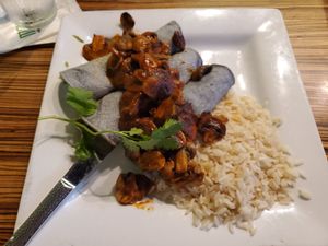 Enchiladas Zapotecas - black corn tortillas filled with guacamole, nopales, salsa, and topped with mushrooms in an adobo sauce. Wow! at Mayahuel in Sacramento