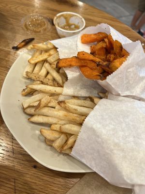 Oven baked fries and sweet potato fries  at B.GOOD - Washington St in Boston