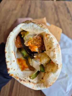 Falafel + veggie wrap $14.00: amazing taste, esp with spicy mango sauce, mixed with potato salad, yumm at Falafel Place in Collingwood