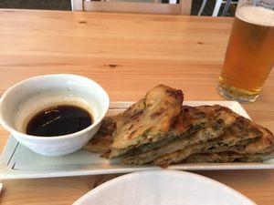 I had a scallion pancake (with tasty chili sweet soy sauce) and a beer.  at V-Vego in Adelaide