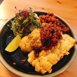 Grilled cauliflower with Taiwan bbq sauce, zucchini noodle and fried chickpea.  at V-Vego in Adelaide