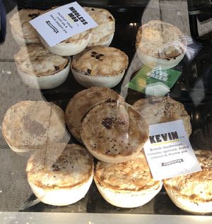 Vegan pies as seen from the shop front at The Black Olive Delicatessen in Southwold