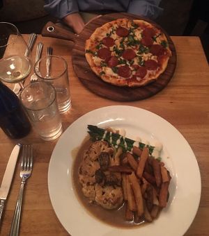 bottom: cauliflower ";steak";     top: vegan pepperoni cheese pizza. at Blossom Restaurant on Columbus in New York City
