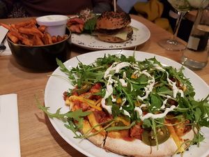 burger with sweet potato fries and pizza at Waku Waku in Utrecht