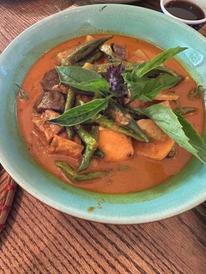 Cà Ri - Yellow Lemongrass Curry
Light coconut curry with fried organic tofu and winter vegetables. Garnished with Thai basil & bird’s eye chilli. at Anh and Chi in Vancouver