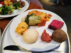 Curry vegetables, shredded carrots with horseradish, bok choy, gluten-free rolls... at Tibits - Seefeldstrasse in Zurich