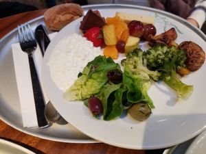 My friend's plate - broccoli, lettuce, olives, fruit salad, cottage cheese, whole wheat bread... at Tibits - Seefeldstrasse in Zurich