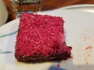 Vegan, gluten-free brownie with coconut shreds on top at Tibits - Seefeldstrasse in Zurich