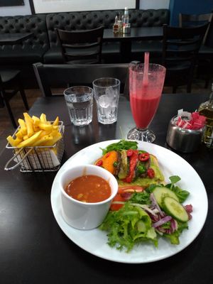 Special of avocado toast with roast peppers, aubergine & courgette. Plus, beans and chips sides. Raspberry orange smoothie   at Fantasia in South West London