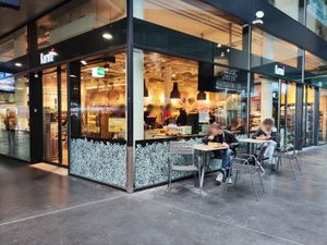 "Outdoor" seating in station hall at Karma in Zug