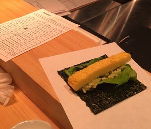 Omelette and nori handroll and the ordering form at Gonpachi - Harajuku in Tokyo