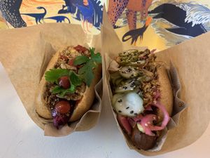 Bbq sausage with kids topping (left), protein sausage with classic topping (right)  at Plantepølsen in Copenhagen