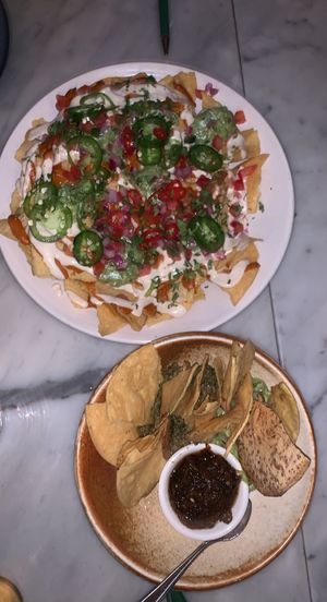 loaded nachos on top - chip&dip on the bottom  at Rosalinda in Toronto