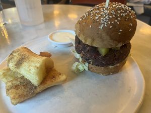 Tosa burger ( black bean, grain and brown rice patty) with yucca fries  at Rosalinda in Toronto