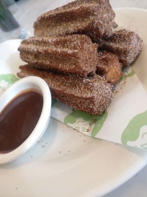 Churros with chocolate-banana-caramel sauce. Amazing. at Rosalinda in Toronto