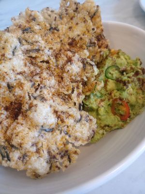 Multigrain chicharron with avocado. So delicious! at Rosalinda in Toronto