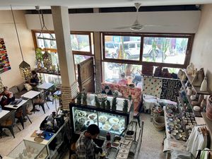 View of counter, seating and shop from mezzanine   at Let's Be in Tamraght
